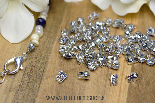 Silver-colored caps 6x3mm, +/- 80 pieces