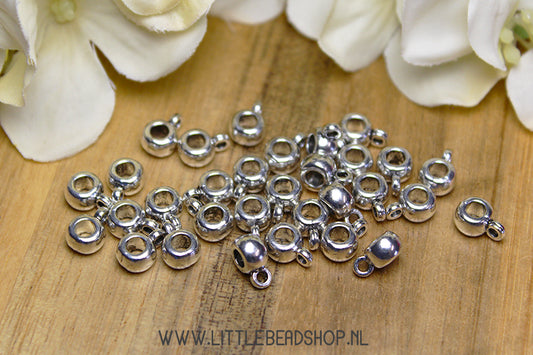 Basic spacer beads with silver eye, +/- 30 pieces