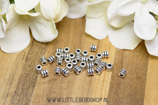 Stripe spacer beads small silver color, +/- 30 pieces