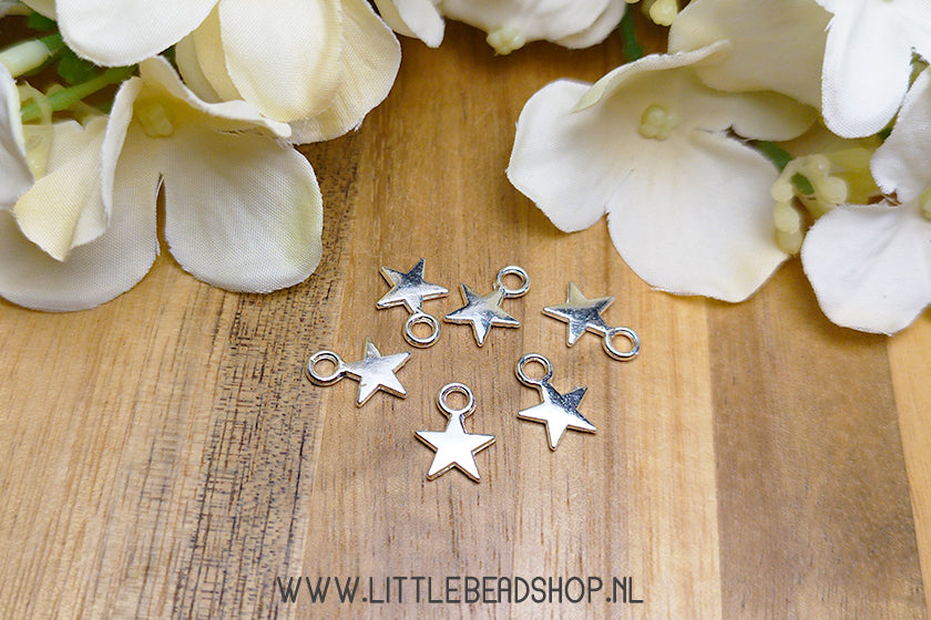 Small star charms, silver color, per piece