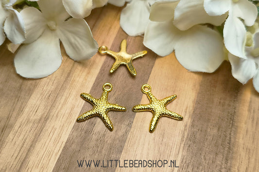Gold-colored starfish charms, per piece