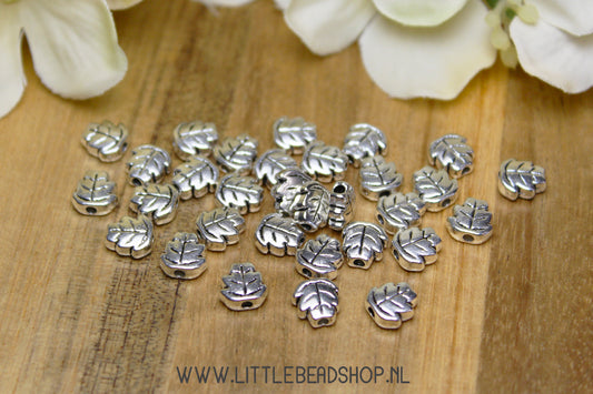 Tussenkralen Blaadjes zilverkleur, +/- 30 stuks