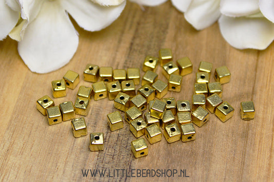 Gold-colored cube spacer beads, +/- 50 pieces
