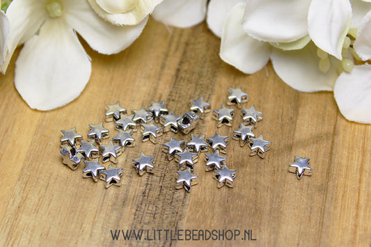 Spacer beads Stars silver color, +/- 30 pieces