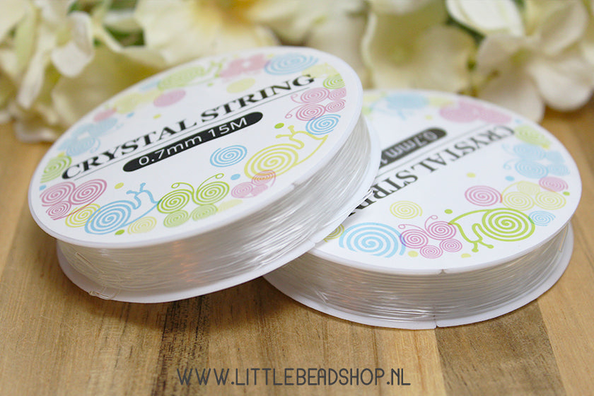 Elastiek transparant 0.7mm, per rol