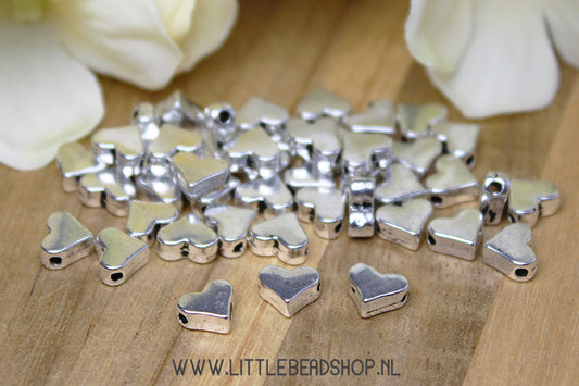 Silver-colored heart spacer beads, +/- 20 pieces