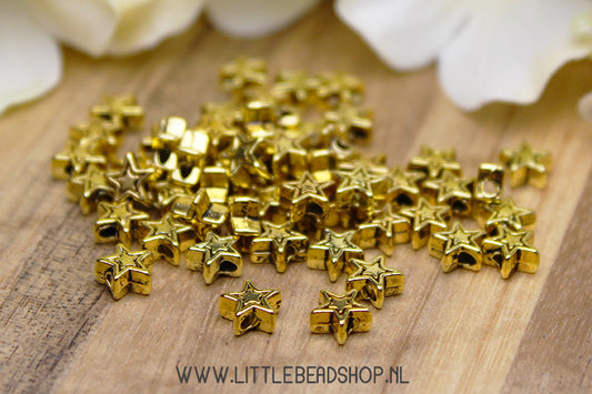 Spacer beads Stars gold color, 30 pieces