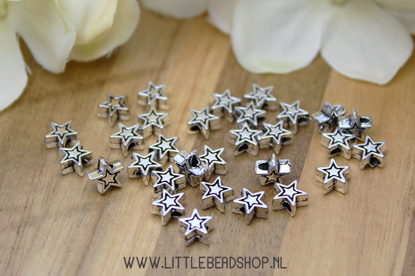 Silver-colored star spacer beads, 30 pieces